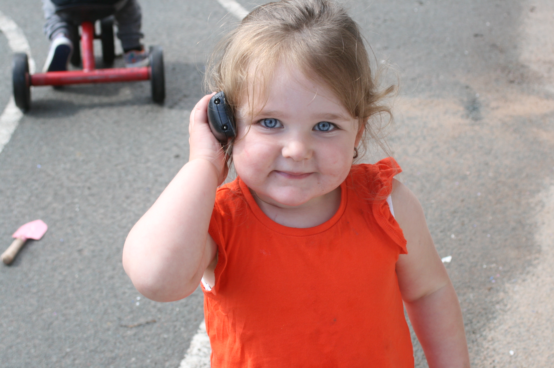 A child playing outdoors at the nursery